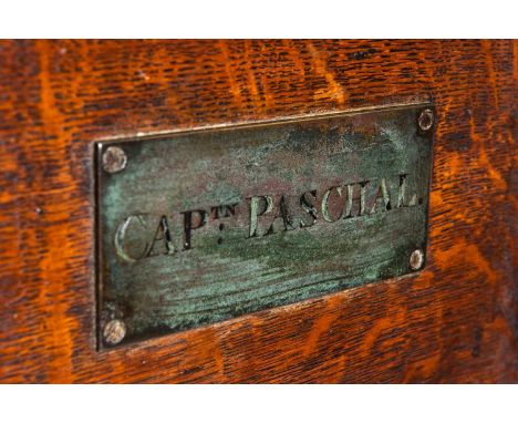 EARLY 19TH CENTURY MILITARY CHEST, with slightly domed lid and iron straps, applied with plaque engraved, 'Captn Paschal', fi