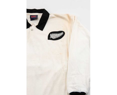 AN UNUSUAL NEW ZEALAND RUGBY UNION JERSEY white body with black collars, Canterbury label for circa 1980s, silver fern to sha