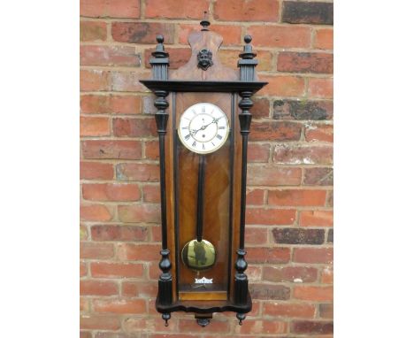 A SLIM CASED 8 DAY VIENNA REGULATOR WALL CLOCK, the mahogany case having ebonised columns, the single train movement having a