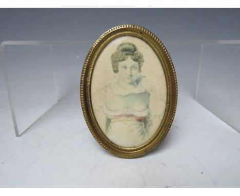 A 19TH CENTURY OVAL PORTRAIT MINIATURE OF A YOUNG WOMAN, unsigned, watercolour on paper, framed and glazed, 9 x 6.5 cm