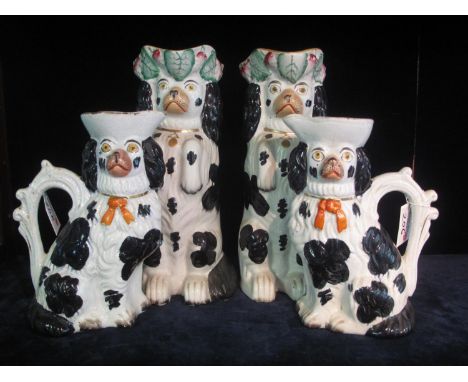 Pair of late 19th Century Staffordshire pottery pitcher/jugs in the form of begging spaniel dogs, together with another pair 