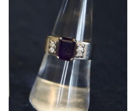 A 14ct white gold amethyst and diamond ring. Ring size M, 5.3g approx. (B.P. 24% incl. VAT)Condition: Centre stone is pockmar