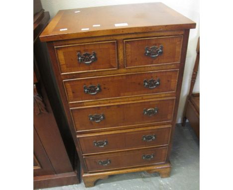 Reproduction yew wood straight front chest of two short and four long drawers on bracket feet of small narrow proportions.(B.