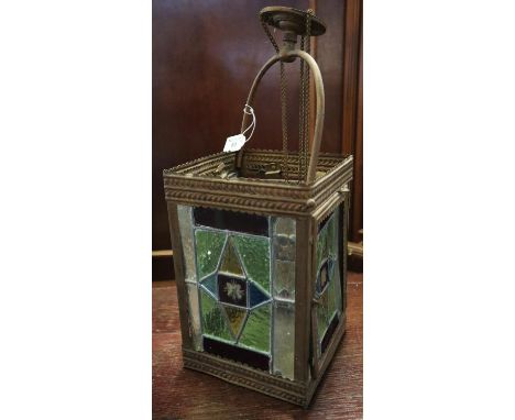 Edwardian lantern four panelled stained glass ceiling light shade with gilded metal mount. 29cm high approx (lantern only).(B