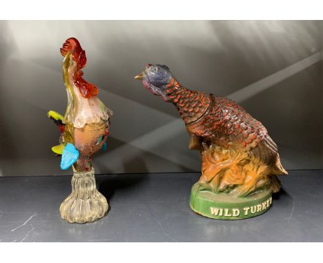 A Murano glass cockerel, H. 27cm. Together with a 1968 wild turkey whiskey decanter (empty).