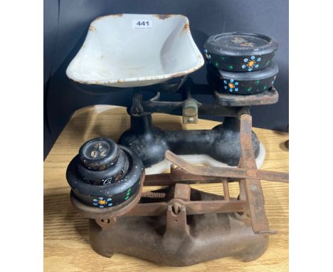 Two kitchen scales and weights.