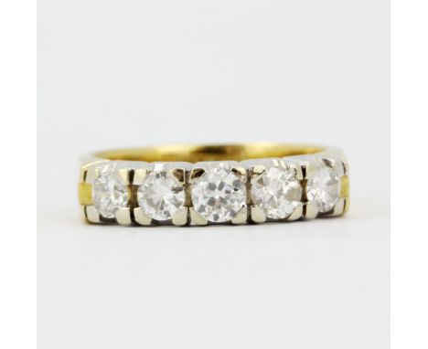 An 18ct yellow and white gold ring set with brilliant cut diamonds, approx. 1.25ct total, (M.5). Approx. 6.3gr.&nbsp;