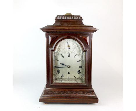 A 19th century chiming bracket clock with silvered dial, H. 46cm.
