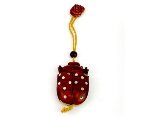 A Japanese carved fruitwood inro, inlaid with mother of pearl and with glass eyes, 8.5cm. Together with a prawn Netsuke, 3cm 