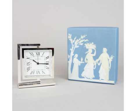 A white metal mounted Wedgwood clock with box, H. 12cm, W. 10cm.