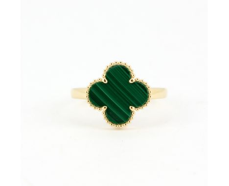 An 18ct yellow gold (stamped 18K) malachite set clover ring, (M.5).