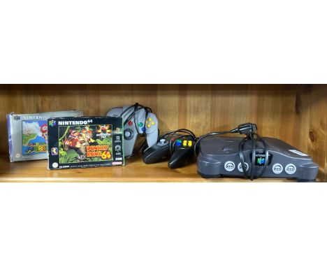 A Nintendo 64 game console and related items.