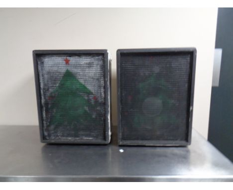 A Squire amplifier together with a pair of speakers. 