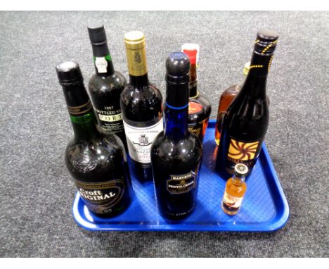 8 bottles of alcohol to include Rioja, 1987 vintage port, Tia Maria, Scotch etc. 