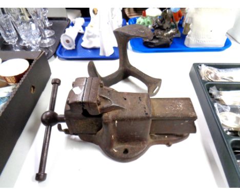 A vintage heavy duty Parkinson's number 5 bench vice together with a shoe last. 