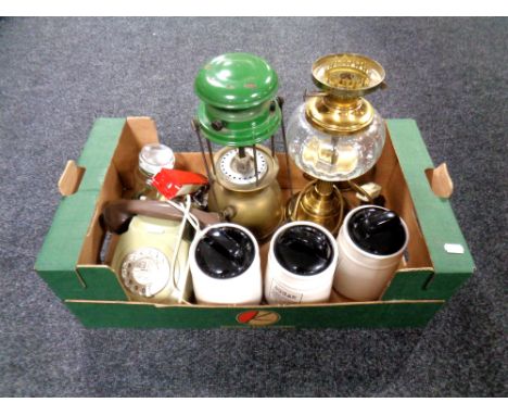 A box containing brass converted lamp, lamp, Tilley lap, vintage telephone etc. 