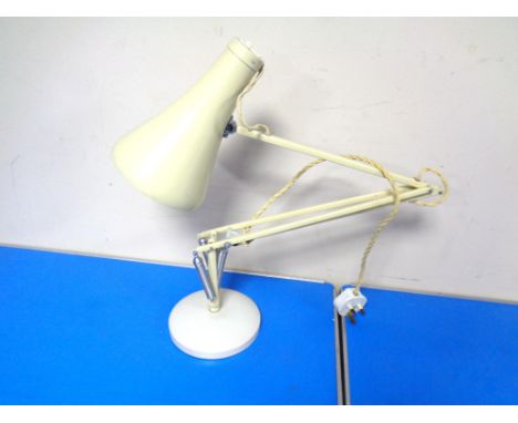 A cream angle poise lamp. 