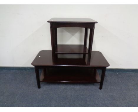 A mahogany coffee table together with matching lamp table. 