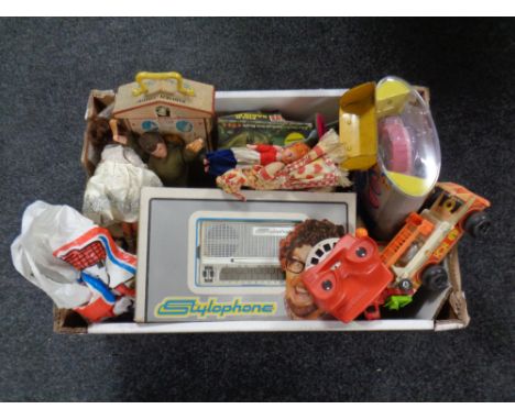 A box of vintage toys to include an action man, stylophone in box, view master etc. 