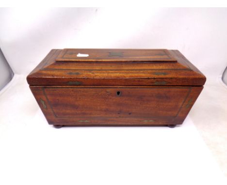 A Regency brass inlaid mahogany tea caddy. 