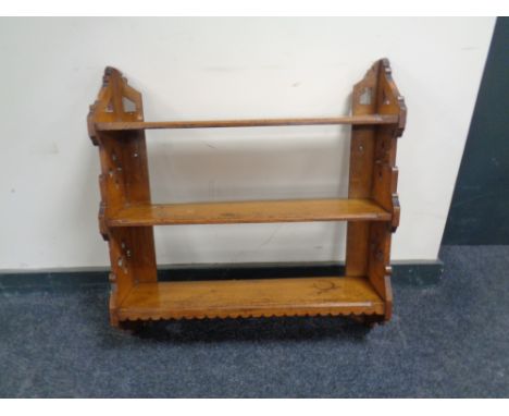 An antique pine three tier wall shelf. 