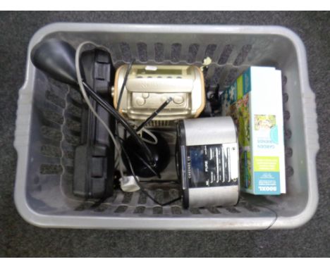 A crate containing Roberts DAB radio, a Pure CD player, jigsaw puzzle, table lamp etc. 