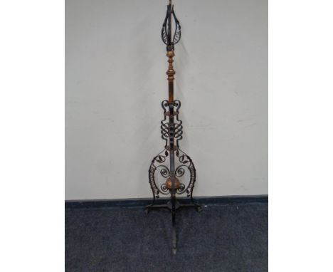 An Arts &amp; Crafts copper and metal floor lamp. 