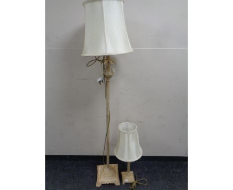 A decorative metal standard lamp with glass drops and shade, plus matching table lamp 