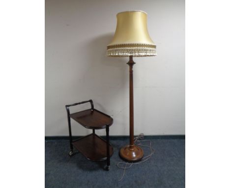 A mahogany standard lamp with shade together with a mahogany trolley. 
