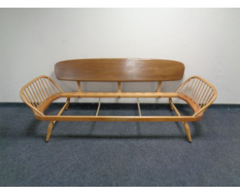 A mid-century Ercol light elm daybed, lacks cushion and webbing