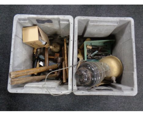 Two plastic crates containing hand tools, pair of candlesticks, a Tilley lamp. 