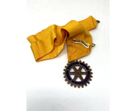 A Rotary International medallion on ribbon 