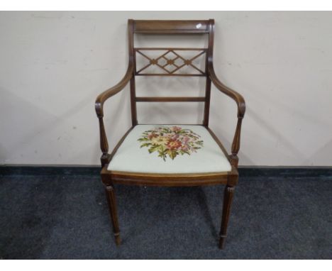 An early 20th century mahogany armchair with tapestry seat. 