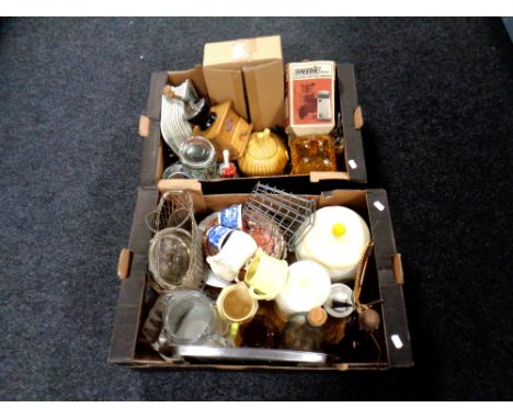 Two boxes containing tea china, silver-plated items, kitchenware, coffee grinder, storage jars etc. 