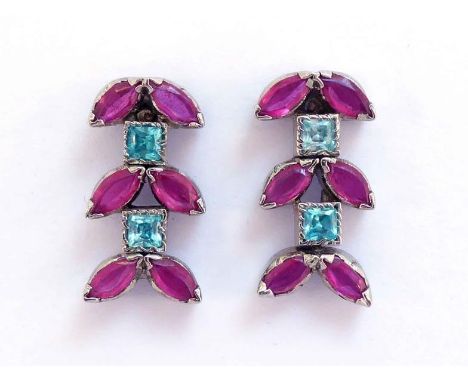 A pair of ruby and blue stone earrings, composed of pairs of marquise cut stones with blue square cuts between, mounted in wh