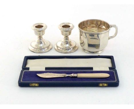 A silver tea or chocolate cup by Fenton Brothers Ltd., Sheffield, 1922, with lobed sides and collet foot, 7 cm. high; a pair 