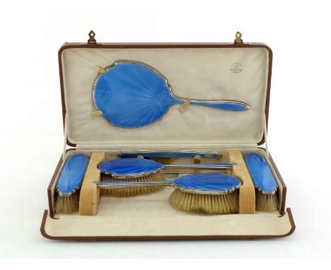 A six-piece silver and powder blue guilloche enamel dressing table set, maker's mark of Adie Brothers Ltd. overstruck by Mapp