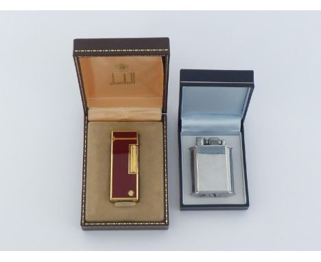 A maroon panelled gold-plated Dunhill cigarette lighter in presentation case, together with a McMurdo petrol lighter in case.