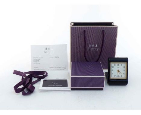 An Asprey travelling alarm clock, the square keywind clock with  Art Deco style face and numerals in a black leather fold-ove
