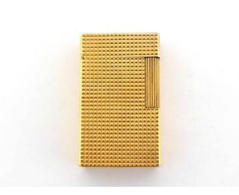 A gold-plated Dupont cigarette lighter with hobnail cut surface, numbered 7176CN.