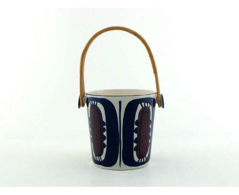 A Danish ceramic ice bucket with cane handle decorated in white and muted red on the white body, "Beehive" mark of the Alumin
