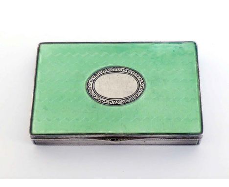 A Continental silver and mint green guilloche enamel box with English import marks for London, 1925, centred by vacant scroll