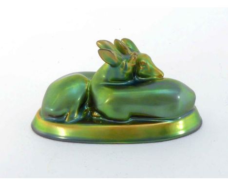 A Zsolnay group of  two young deer in green gold iridescent glaze, the underside with Zsolnay gold stamp. 16cm. long. 