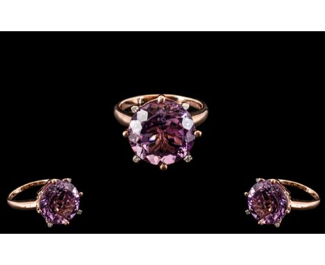 Amethyst Solitaire Style Statement Ring, an 11.5ct round cut amethyst, accented with four small diamonds set to the tips of f