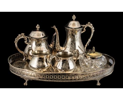 Plated Ware Tea Service &amp; Tray.  Large oval silver plated tray raised on claw feet,  with a Tea Pot, Hot Water Pot, Milk 