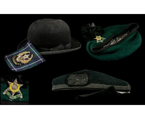 Burma Star Enamel Association Badge on a green beret, together with a Cameronians Highland Badge with a Black Watch beret, to