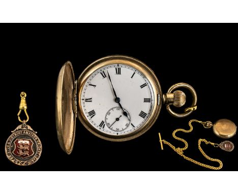 A Full Hunter Pocket Watch, white enamel dial, Roman numerals with subsidiary seconds.  50 mm Gold Plated case.  Movement mar