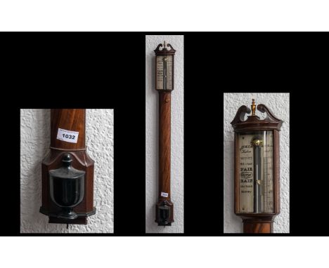 A Reproduction Mercury Stick Barometer in a walnut case engraved JVRN. Desterro Lisburn with a silver barometer scale plate. 