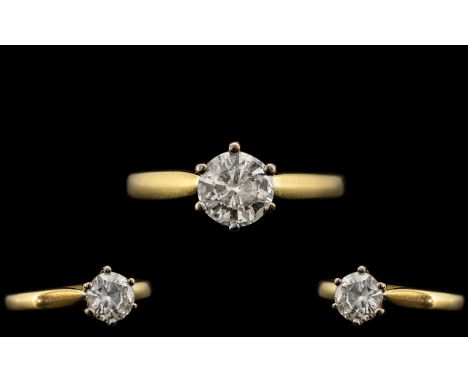 18ct Gold and Platinum Single Stone Diamond Ring. Full Hallmark for 750 - 18ct. The Round Brilliant Cut Diamond of Excellent 