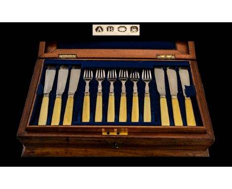 Cutlery Set Housed in a Handsome Polished wooden box with brass cartouche to centre, complete with key.  First level in box h